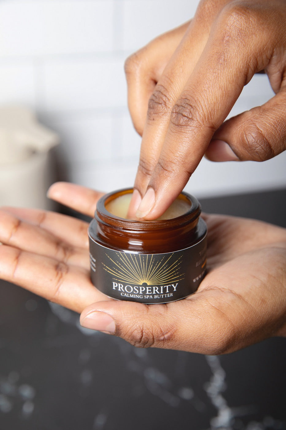 A fingertip scoop from the Prosperity Butter™ 1oz jar