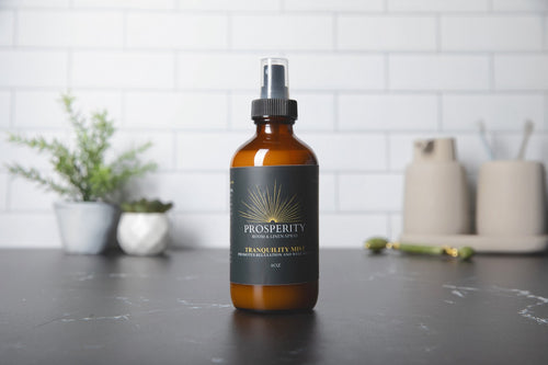 Tranquility Mist room and linen spray on a bathroom counter