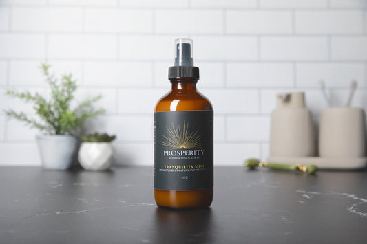 Tranquility Mist room and linen spray on a bathroom counter